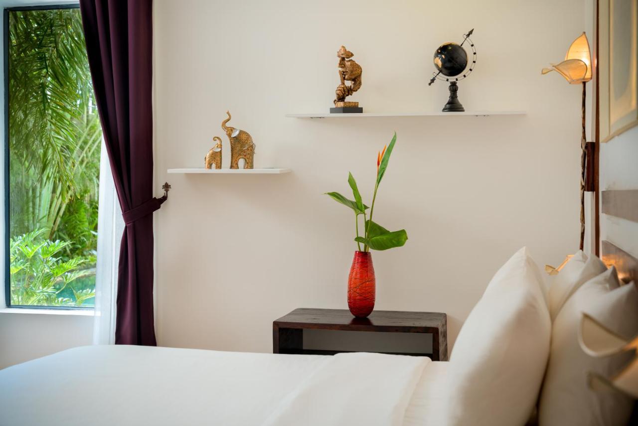 The Thirdfold Residence Siem Reap Extérieur photo A bedroom at the hotel